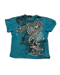 Sovereign Tee - teal tee with all-over gothic script, crest shield and MCMXCI graphic